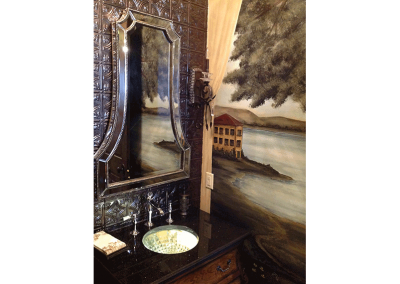 This bathroom features a hand-painted mural on two walls.